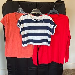 3 women size medium shirts. Crop top, skirt sleeve, and long sleeve.